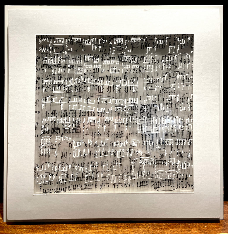 a square artwork comprised of black and white musical notes drawn on various sheets of clear acrylic paper, overlapping and casting shadows on a white background.